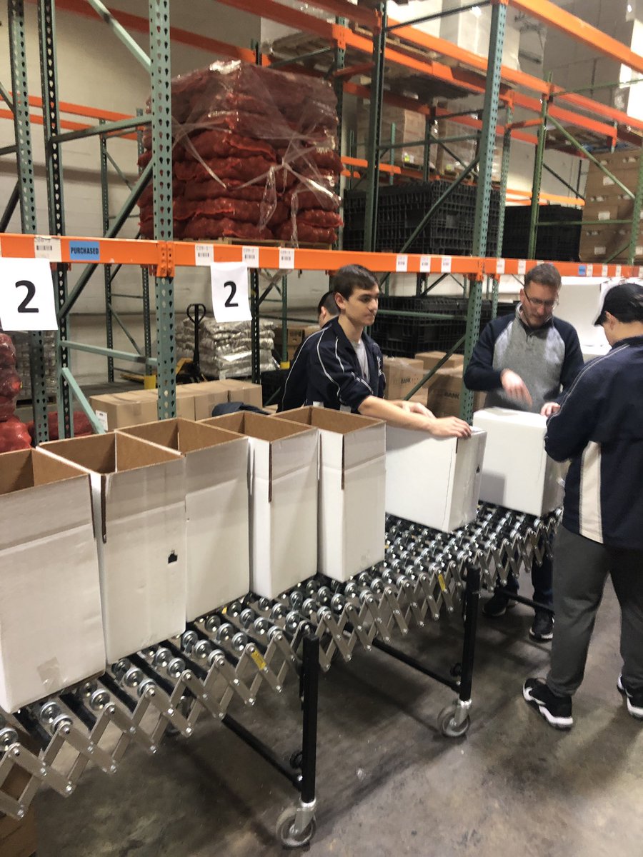 Second Harvest support .  200 Christmas food boxes and 180 family bagels packed.  Feels great to help !!