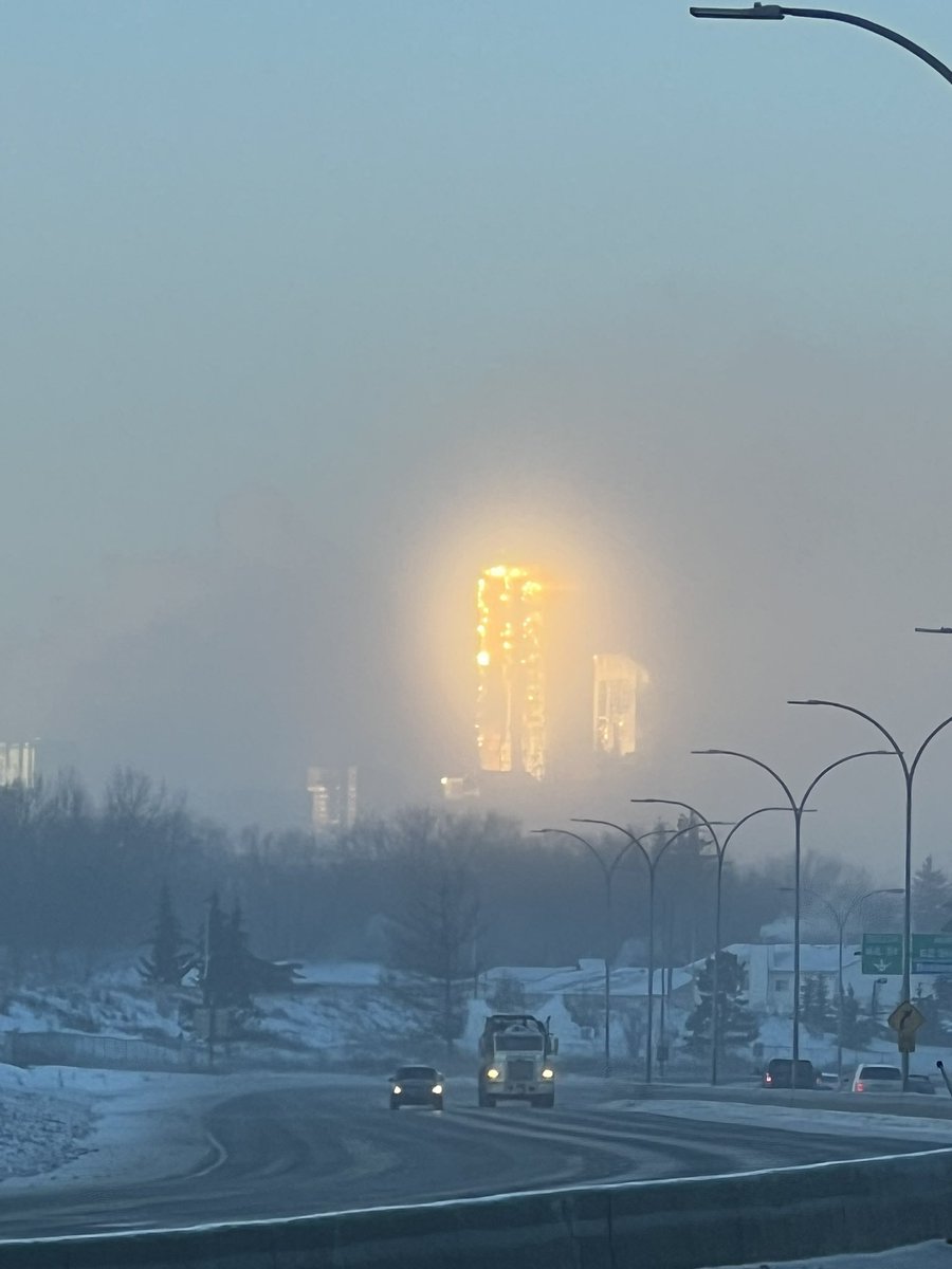 HRProf_Mike's tweet photo. JW Marriott in downtown Edmonton looked like it was on fire this morning.  Fortunately, it was sun reflection and ice fog. @ctvedmonton @GlobalEdmonton (pics taken while safely parked) https://t.co/LjKzVVjf4n