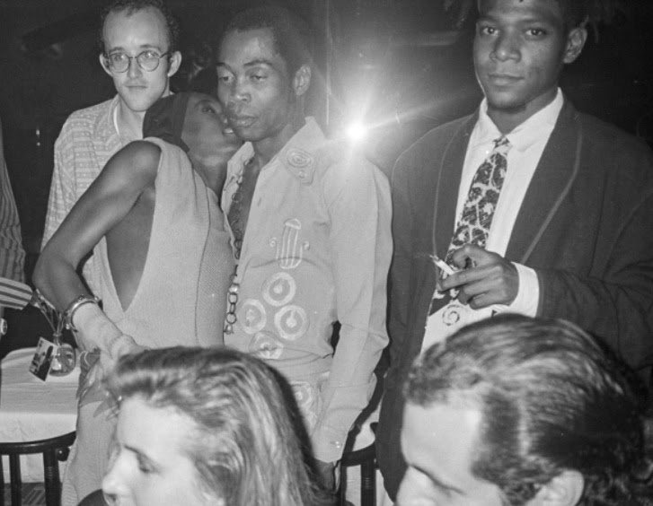60sto70sto80s's tweet photo. Midtown Manhattan, NYC (1986). Keith Haring, Grace Jones, Fela Kuti, and Jean-Michel Basquiat enjoy their time at Mr. Chow restaurant on 57th Street. Photographed by Andy Warhol. https://t.co/CbMuBEa7a8