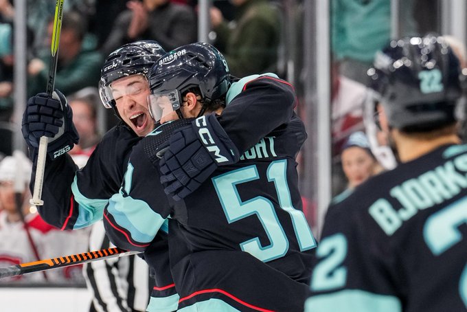 Dunner bear hugging Shane after his first nhl goal