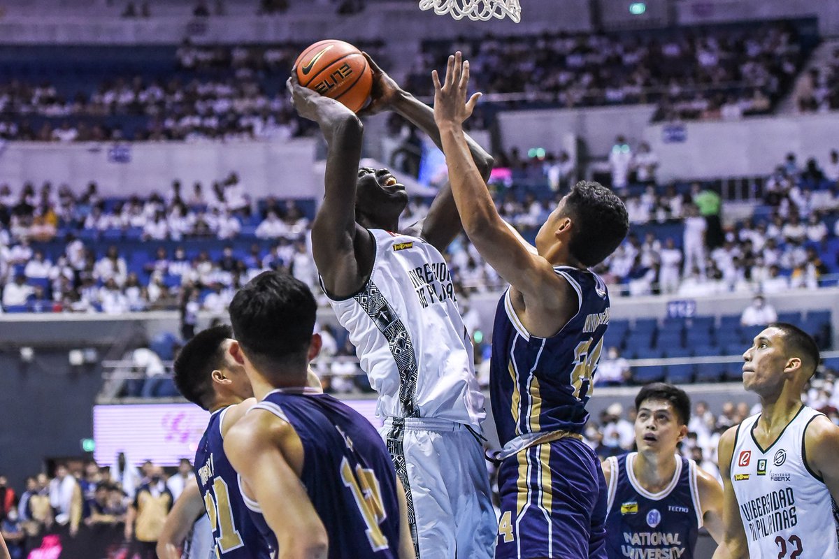 upmaroonpride's tweet photo. FINALS-BOUND! The UP Men's Basketball team secures a spot in the #UAAPSeason85 finals after beating NU! Congratulations, UP! #UPFight #MaroonPride https://t.co/5fliEMnpAm