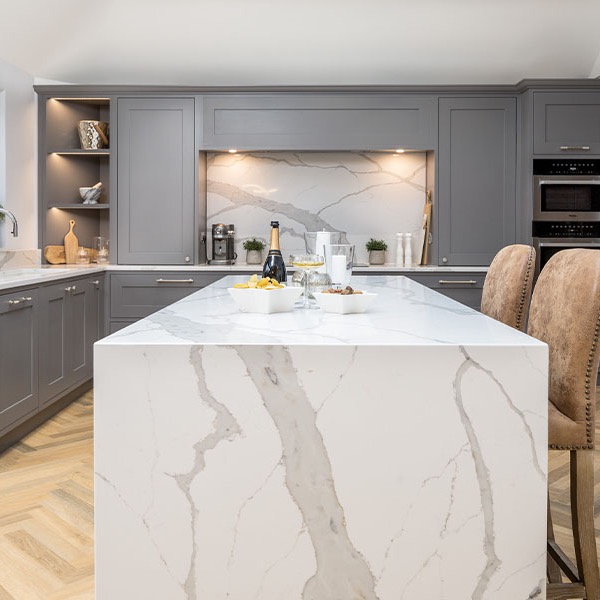 In your element. This kitchen has earthy undertones; the stone-coloured units, the natural wood floor, the exquisite quartz splash back, work surfaces and end panel… you cannot help but feel calm and grounded.