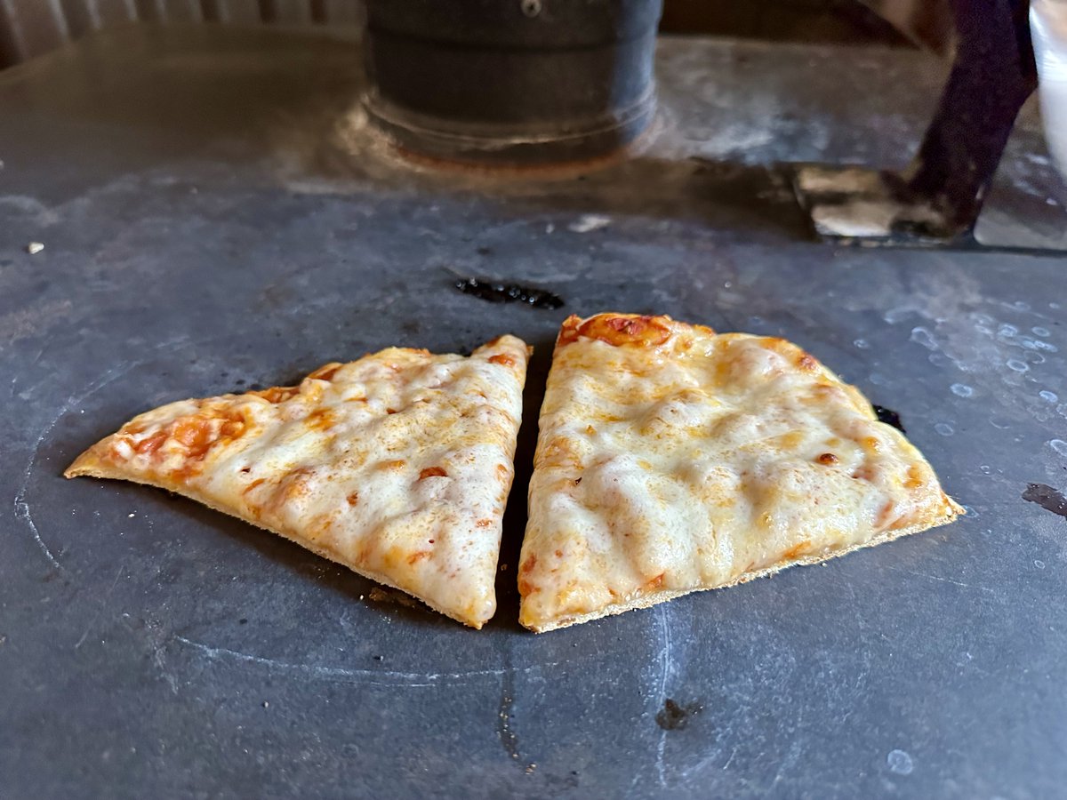 The best part of waking up is...

pizza on the woodstove?!