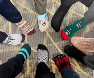 boonebank's tweet photo. The Boonville bankers are always putting their best foot forward!  They held their annual “sock exchange” yesterday and are pictured here showing them off.  The socks represent the two Boonville branches well. Warm and fuzzy, festive, and fun! https://t.co/Vj5zmb3xCi