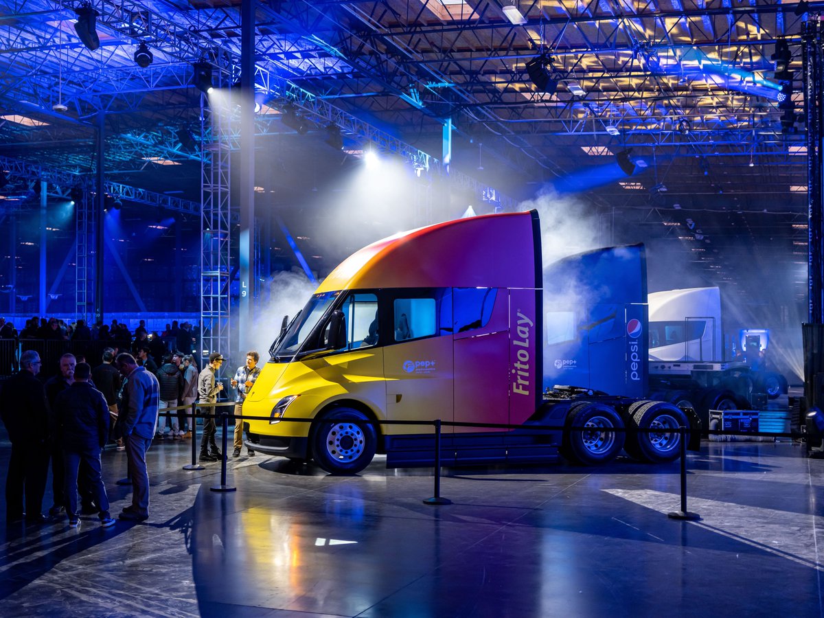 Tesla's tweet image. Delivered our first Tesla Semis last week ✌️