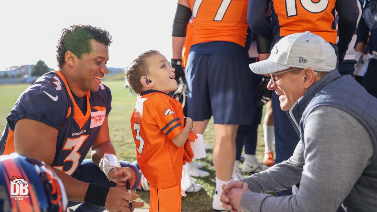 Broncos's tweet photo. This is what it’s all about. 🧡

Owner/CEO Greg Penner joined several Broncos players in welcoming Cooper, our @ChildrensColo junior reporter, after practice today. https://t.co/W1RZcpcwJU