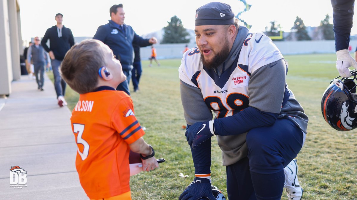 Broncos's tweet photo. This is what it’s all about. 🧡

Owner/CEO Greg Penner joined several Broncos players in welcoming Cooper, our @ChildrensColo junior reporter, after practice today. https://t.co/W1RZcpcwJU