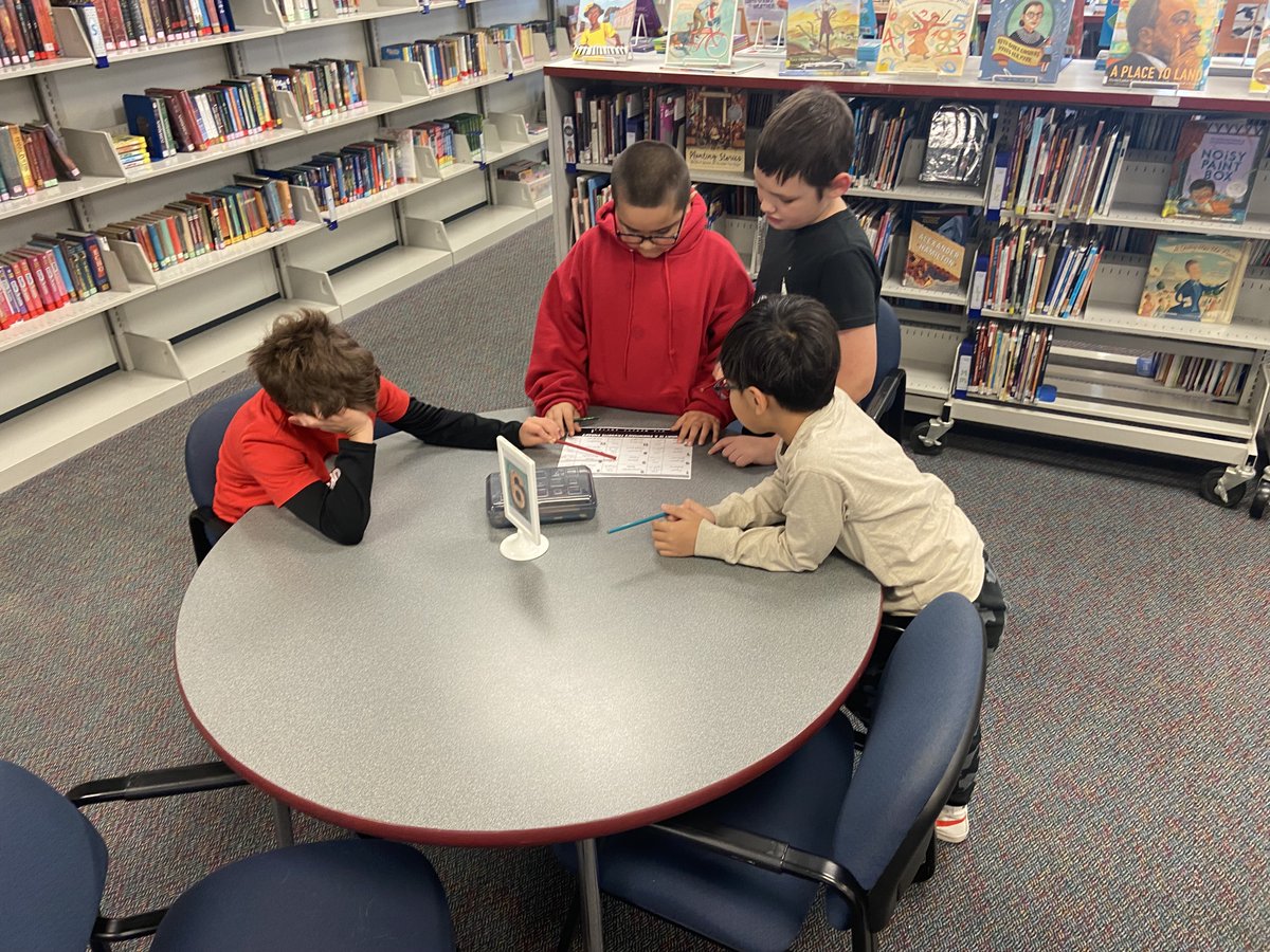 3rd graders are freshening up their call number skills to crack the code and find the punch line of their joke!