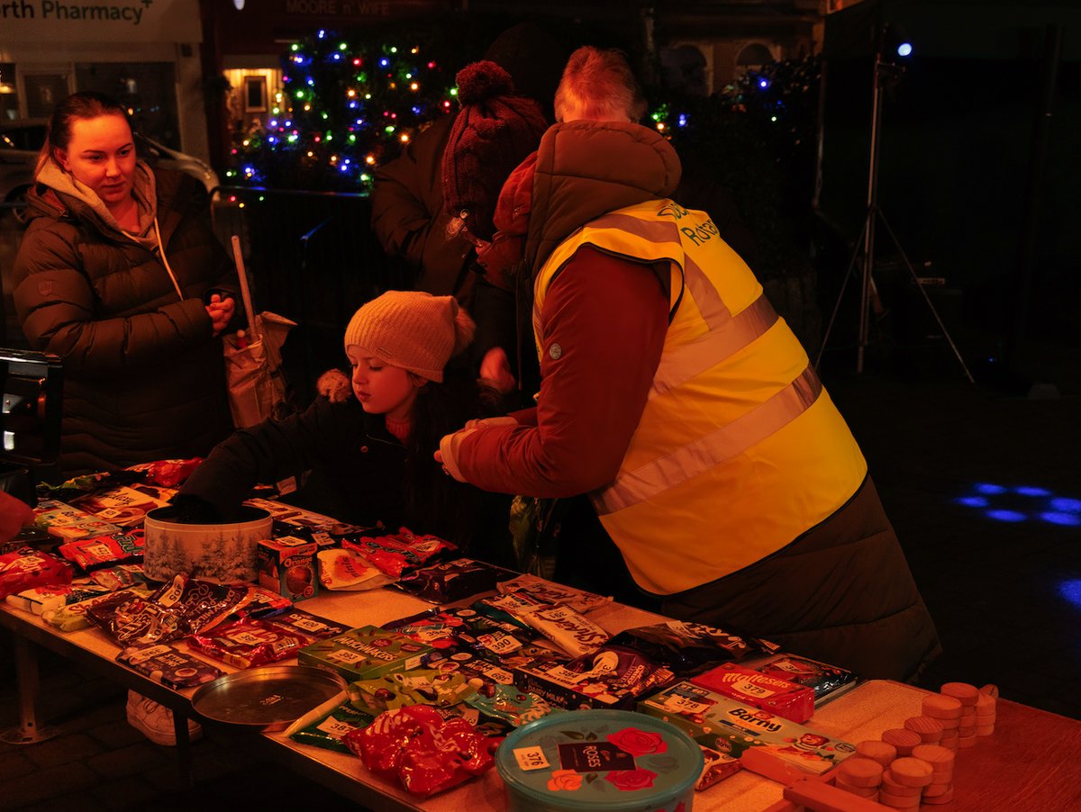 CarnforthRotary's tweet image. Carnforth Rotarians ran the Chocobola stall at the Christmas lights switch on in Market Square. The stall was very colourful  with lots of donated chocolate goodies. It was a very busy evening with everyone being a winner. The prize of course was chocolate in some shape or form.