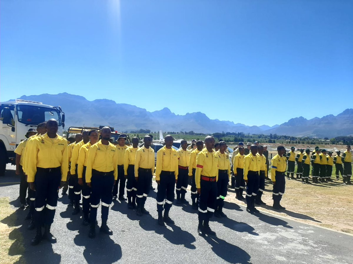 wo_fire's tweet photo. The Working On Fire Jonkershoek team sings the national anthem ahead of demonstrations at the Western Cape Fire Readiness event at the Stellenbosch airstrip.
#WorkingOnFire #SummerFireSeason
#KishuguAviation https://t.co/BEFBdIZk3m