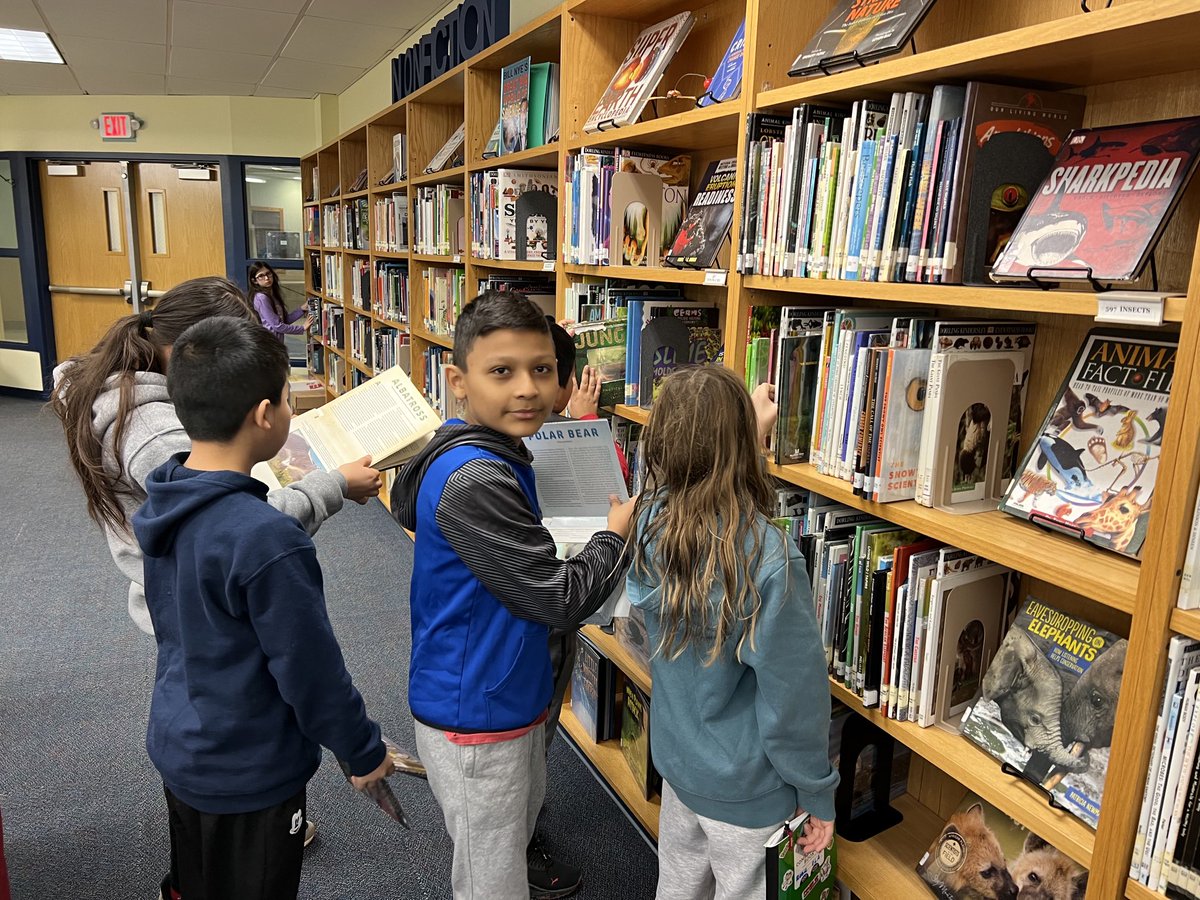 5th graders visit the library to gather resources for their independent research projects