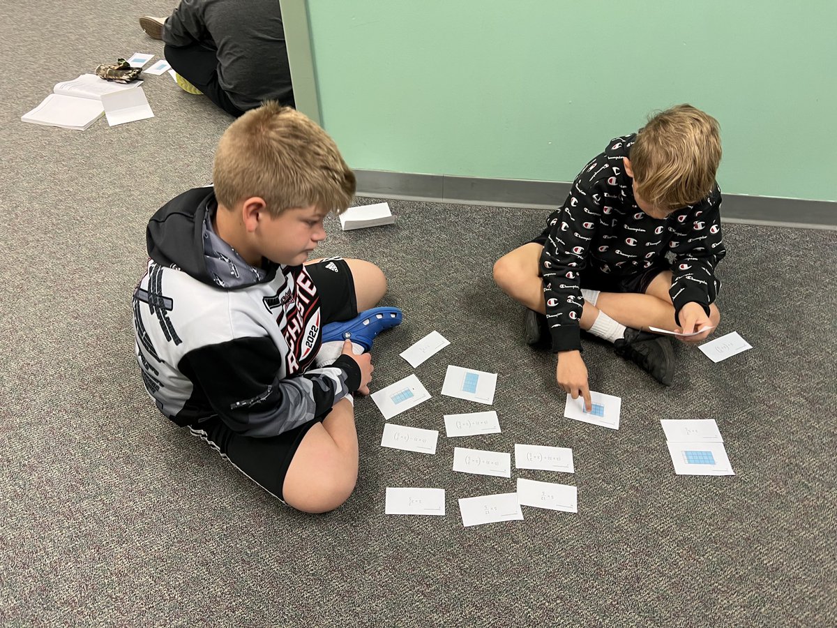 5th graders multiply fractions with area models