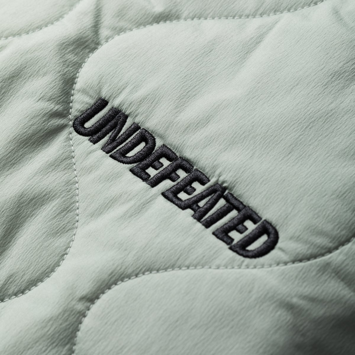 UNDEFEATEDinc's tweet photo. A detailed look into UNDEFEATED Holiday 22 - Drop 3

Our 3-IN-1 Jacket is a warm and versatile winter piece. It features a polyester shell with a detachable quilted liner jacket that can be worn on its own.

Available Friday, 12/9, exclusively at https://t.co/rPhV7ZxZDc https://t.co/vlPdqs5zpF