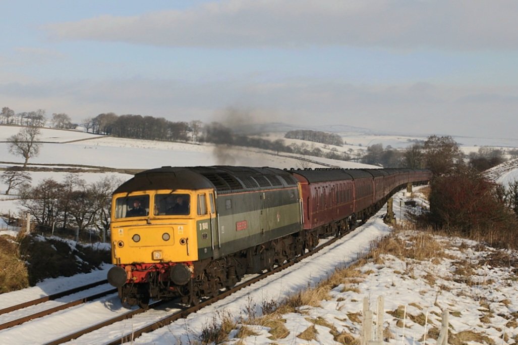 With December's first snowfalls in mind, here's Class 47 D1648 'Traction Magazine' passing Otterburn, North Yorkshire on 7th December 2008 with ECS to Carnforth after working Lincoln Christmas Market specials the day before.

#Class47 #BrushType4 #BRGreen #WestCoastRailways #Snow