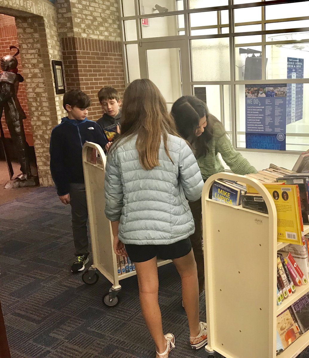 PaceWoodruffLib's tweet photo. As usual, we had lots of fun at our Holiday Book Bonanza in the middle school this morning, checking out “as many books as you can carry” for the winter break.  😁📚 https://t.co/c6AqftFk0e