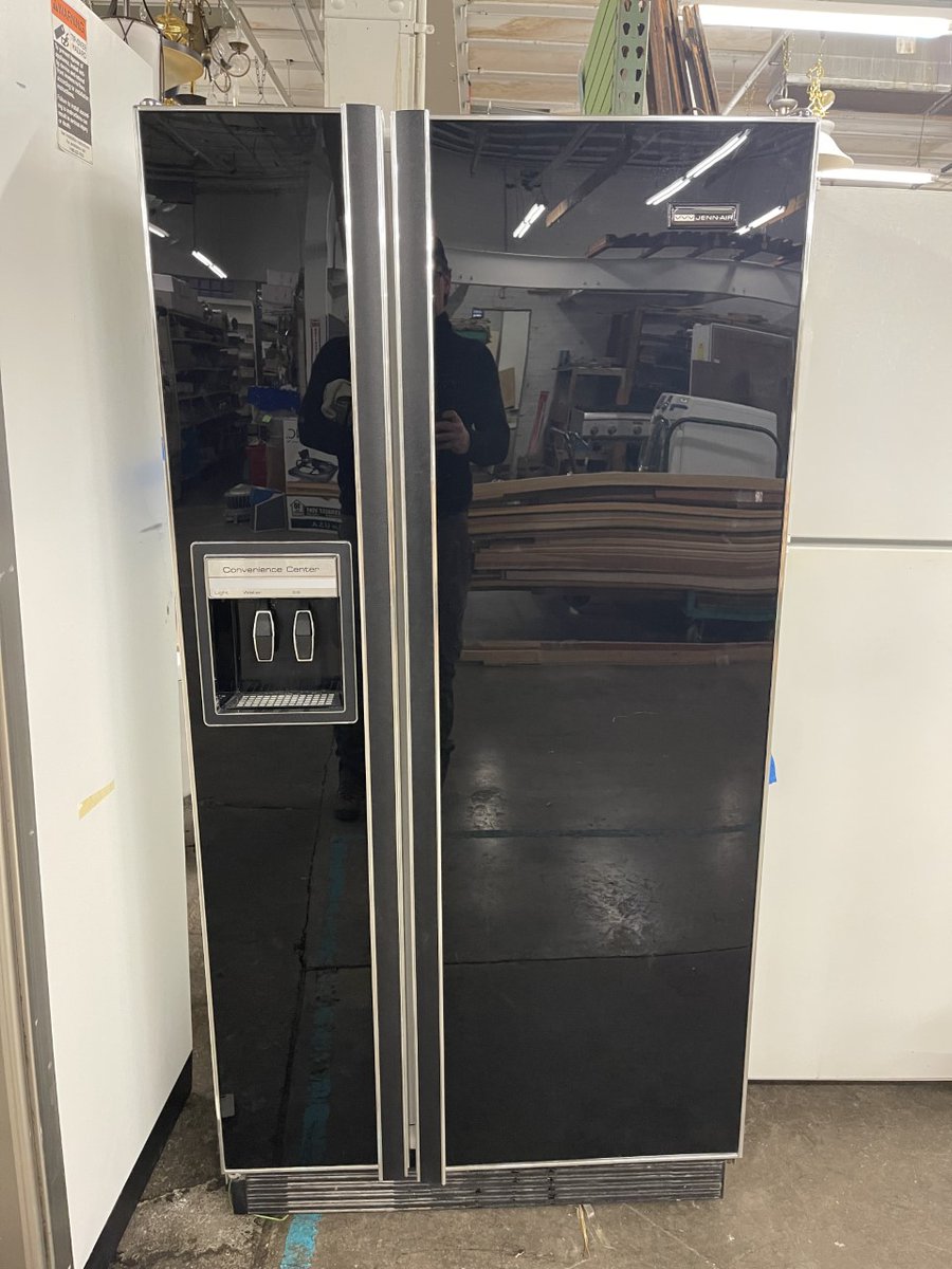 BuildingValue's tweet image. Vintage ‘black glass’ Jenn Air side by side refrigerator/freezer. The black glass doors are stunning, sleek and modern despite the fridge’s age. Simply a beautiful refrigerator that is in great condition. Dimensions: 66” tall x 33” wide x 28” deep.
