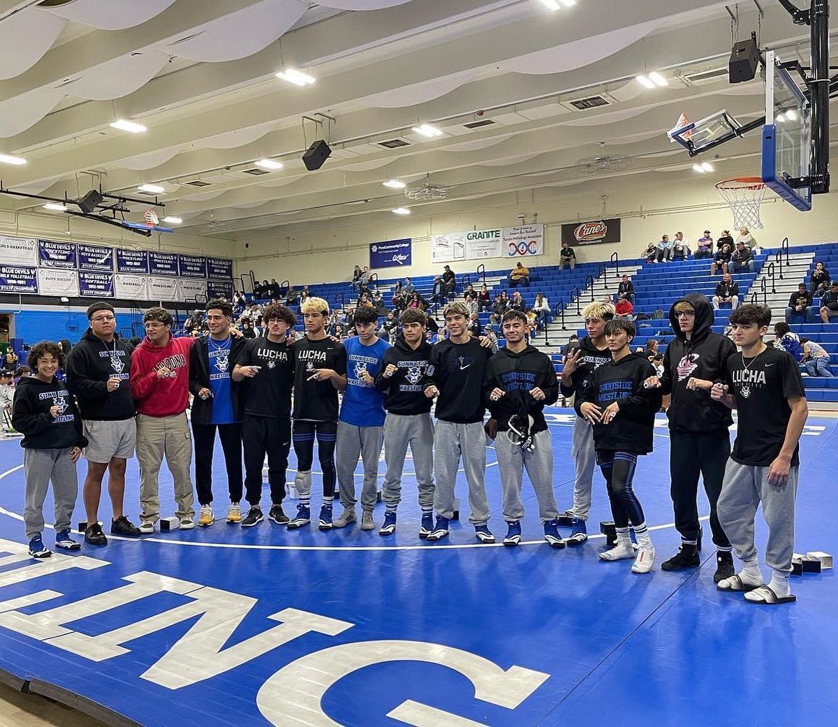 STATE CHAMPIONS HONORED! 

During the opening match of the season, last year's state champion wrestling team received their state rings! Congratulations, Sunnyside Blue Devils!