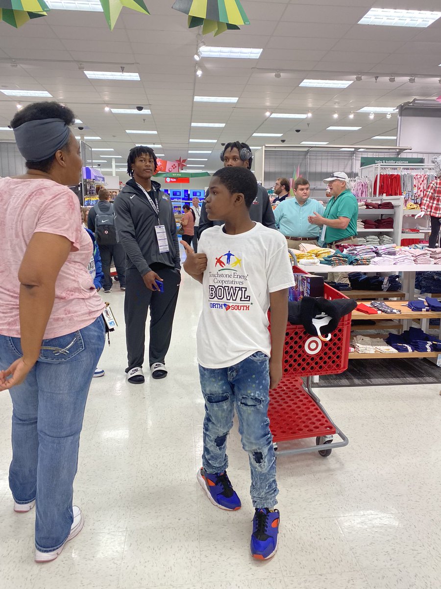 The players from the Touchstone Energy Bowl are here at Target shopping with elementary school kids in the area to get some items off of their Christmas list