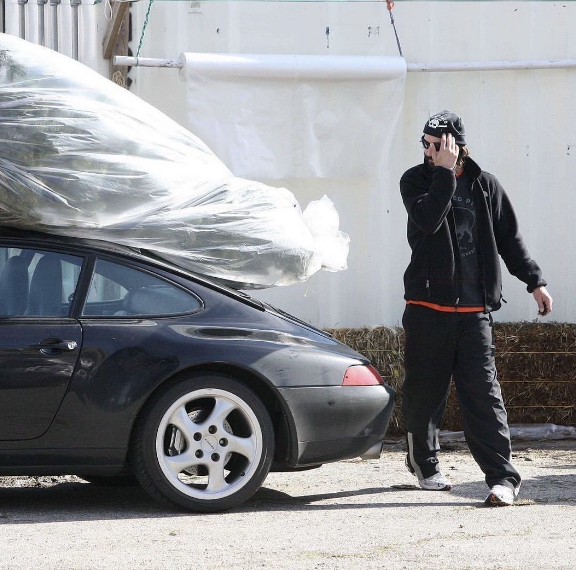 You may be cool but are you Keanu Reeves strapping a Christmas tree to his Porsche 993 cool?