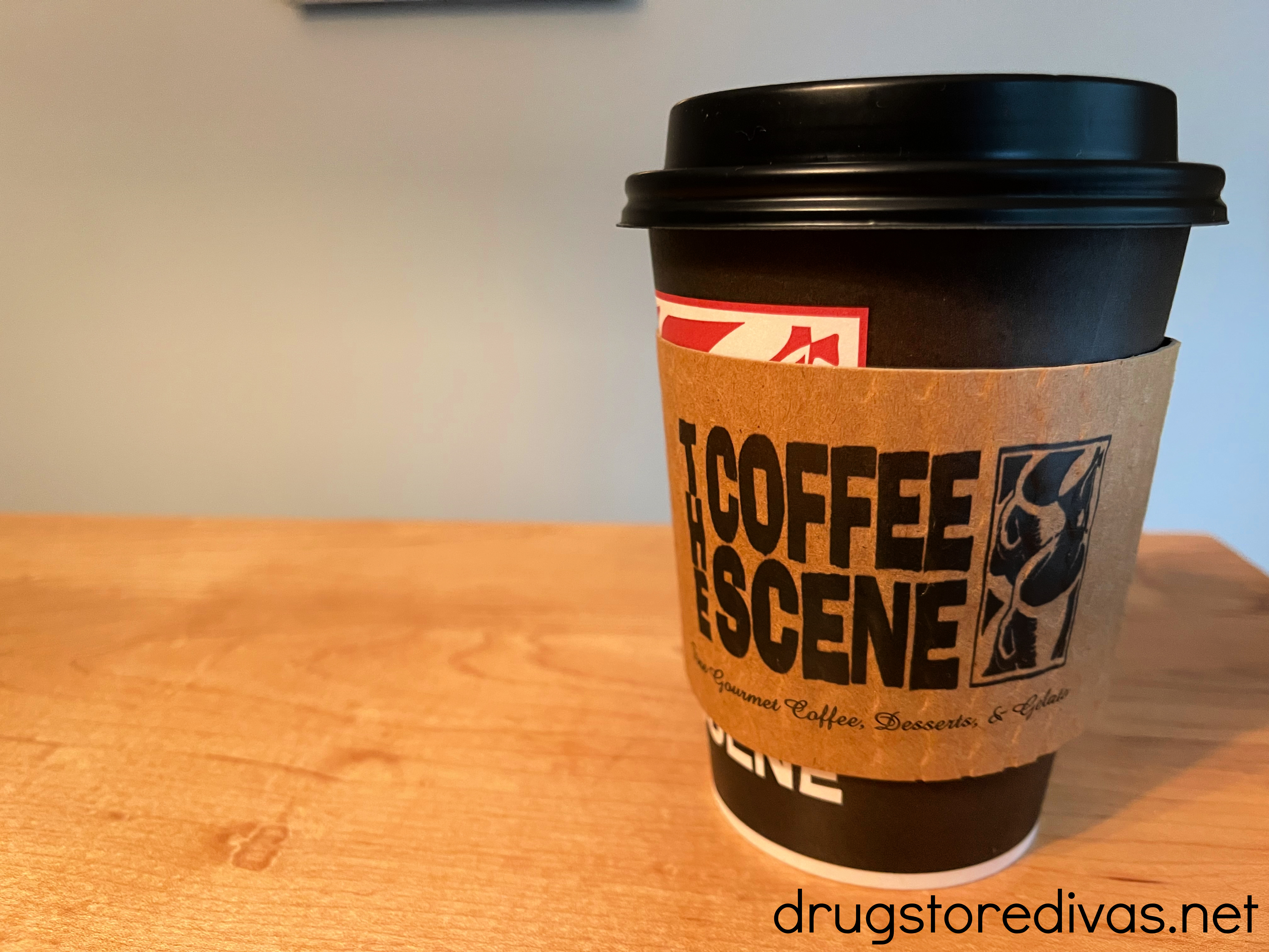 A coffee from The Coffee Scene in Fayetteville, NC on a table.