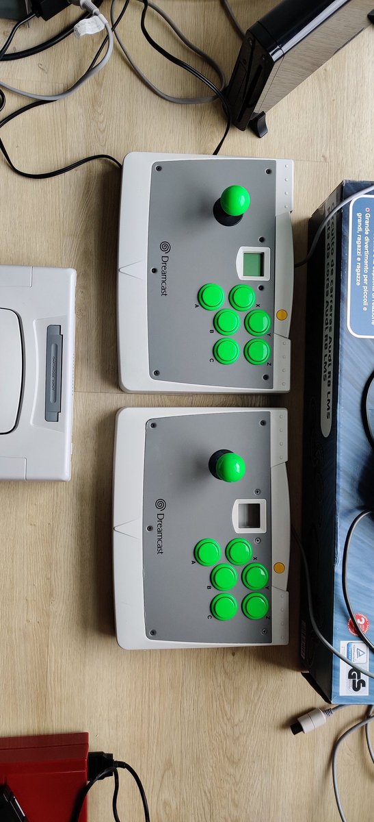 hitmanmcc's tweet photo. #Sega #Dreamcast arcade sticks. I forgot to take a before picture but the bottom one was yellowed. Now I cannot tell them apart by colour. I can still tell them apart by the damage the rust caused on the grey plate, causing the corners to peel. #RETROGAMING #retrobrighting https://t.co/PybE37UixO