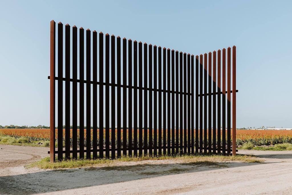LiberatusDC's tweet photo. A fence in the middle of a field. Step into the story of why we advocate for the displaced with us and our partner orgs @borderperspective and @refugecoffeeco by getting a copy of Volume One—or by joining our team as we create Volume Two and reach for the big goal of biannua… https://t.co/Dz0peoZhzD