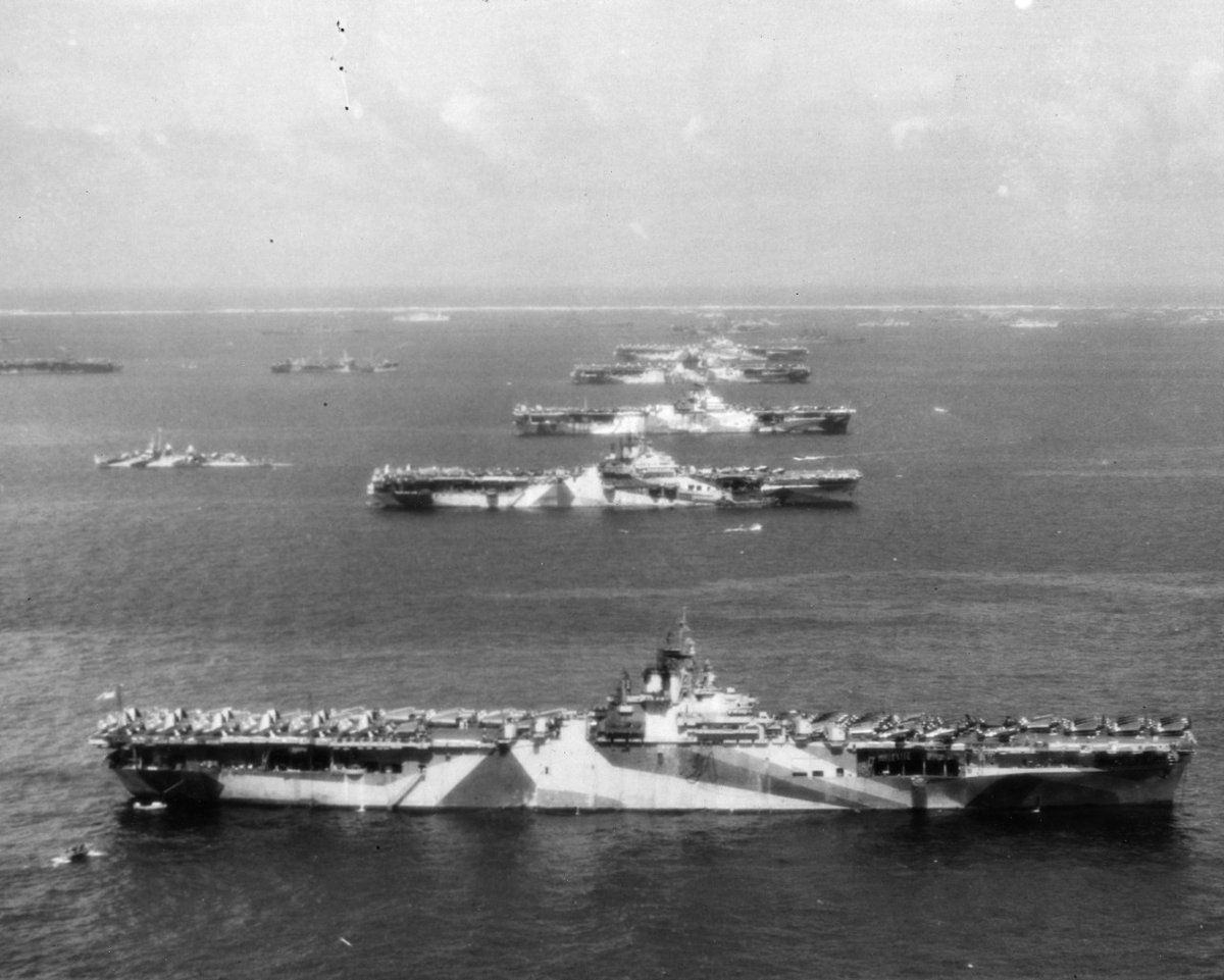 NavalInstitute's tweet photo. #OTD in 1944, the "Murderers' Row" of Third Fleet aircraft carriers were at anchor in Ulithi Atoll. From front to back: USS Wasp (CV-18), USS Yorktown (CV-10), USS Hornet (CV-12), USS Hancock (CV-19) and USS Ticonderoga (CV-14). https://t.co/208fhvRxsv