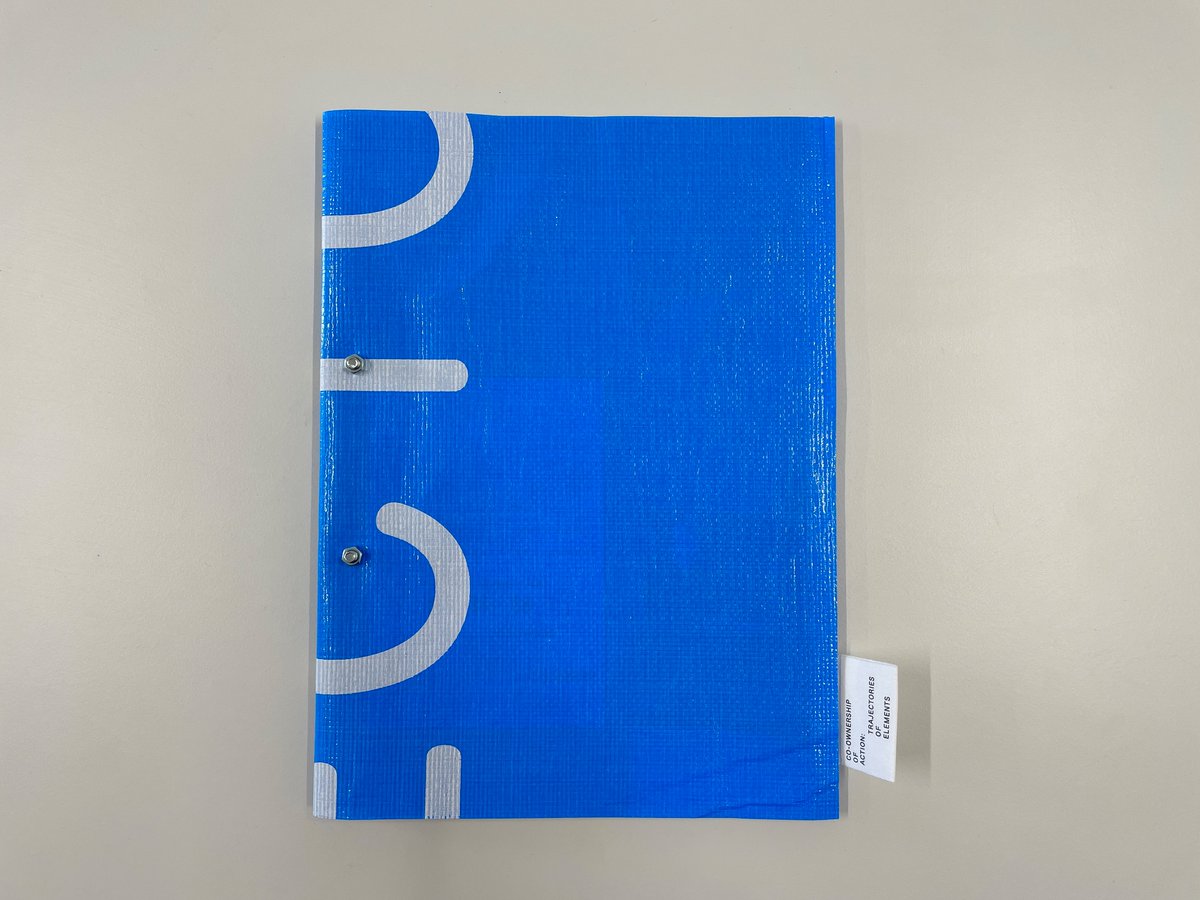 y_yamasaki's tweet image. 2021ヴェネチアビエンナーレ国際建築展日本館のカタログ（クラファンのリターン）が届いた。ブルーシートをアップサイクルした表紙に、Trajectories の一部が入っていてかなりうれしい…！ 時間も空間も超えて、ようこそ…という気持ちになる。