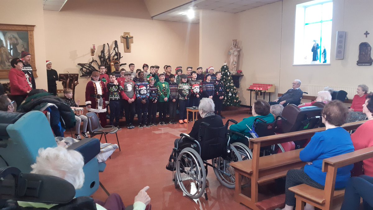 Pupils from Scoil Phádraig Naofa sharing their Christmas music and songs with the residents of St. Vincent's CNU Mountmellick.
