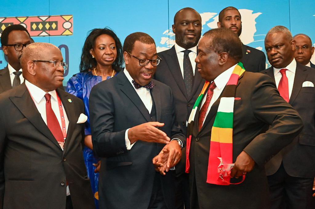 richard_uku's tweet photo. Zimbabwean President @edmnangagwa chats with @AfDB_Group President @akin_adesina at the Africa Caribbean Pacific Summit in Luanda, Angola today. Dr Adesina is Champion of Zimbabwe’s arrears clearance and debt resolution process. #OACPSSummit. https://t.co/Yv7fqDnLO0