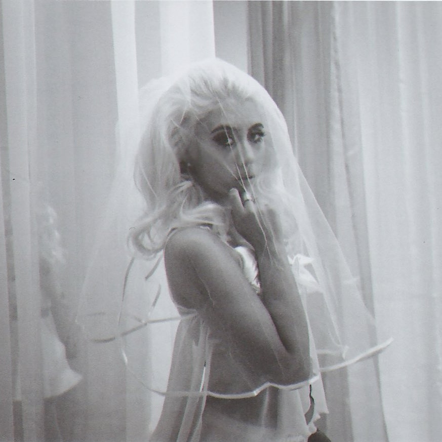 kali uchis silver dress Kali Uchis Stars In H&M Studio's Glamorous New Spring Campaign