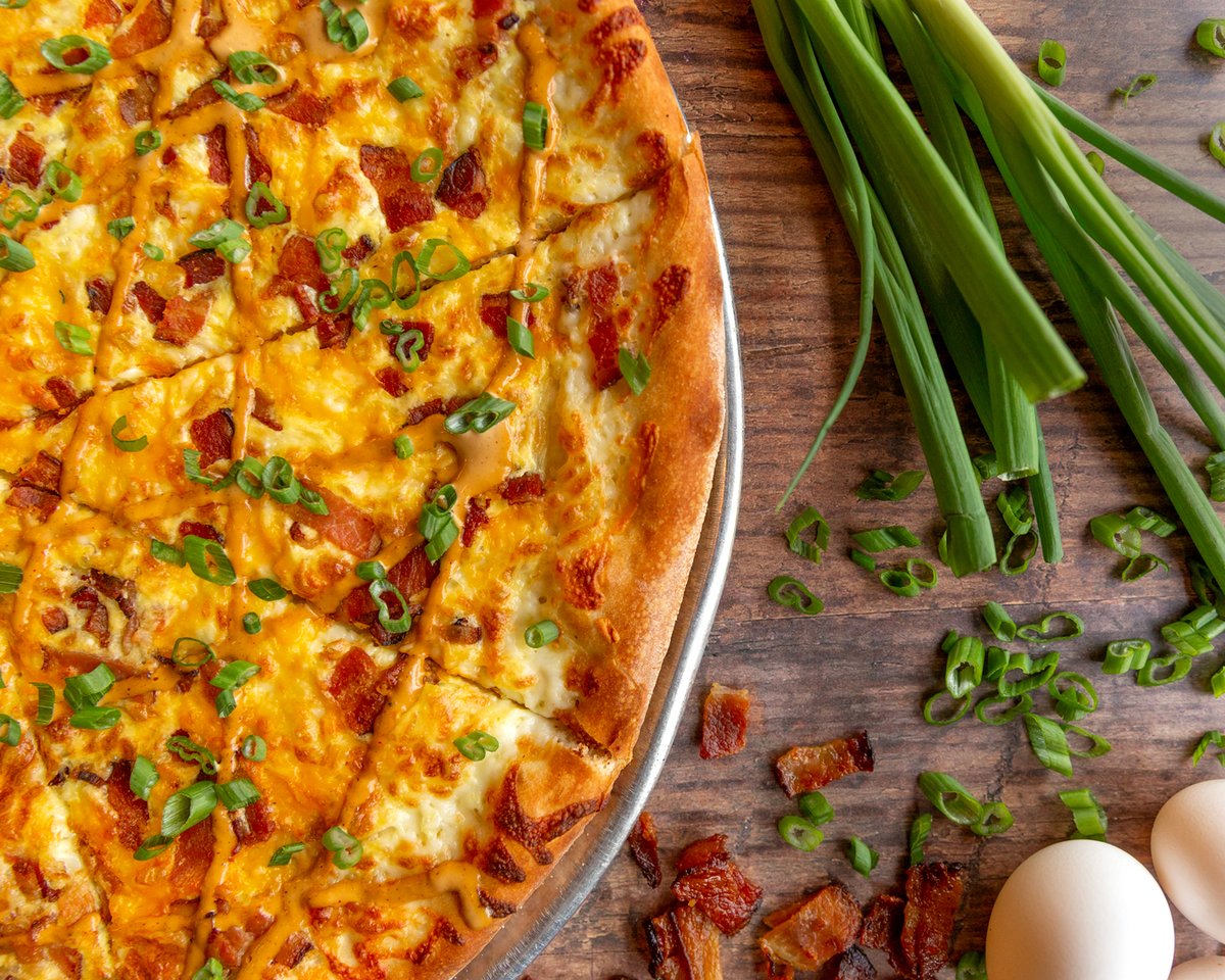 piesandpints's tweet photo. Your weekends just got a whole lot better... introducing the Brunch Pie! This new specialty pie features pizza cheese, cheddar, scrambled eggs, bacon, Chipotle crema and scallions. We'll be serving it up every Saturday and Sunday from 11am-3pm starting TODAY! #getsome #brunchpie https://t.co/iJcYz4t5Eu