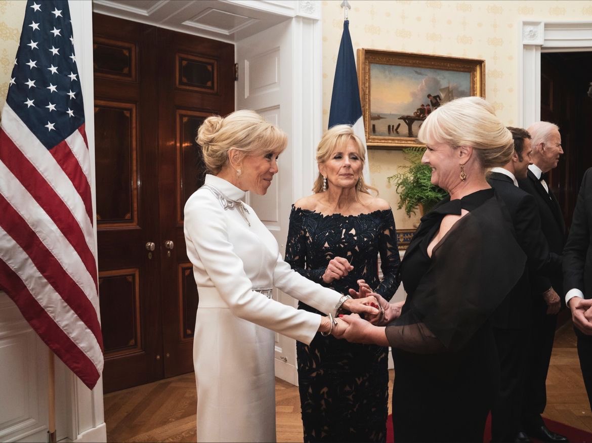 DLPReport's tweet photo. Official photo of Disneyland Paris President Natacha Rafalski during her visit to the White House as part of the French delegation. Natacha is pictured here with the Macrons and the Bidens: https://t.co/WQ000ymJJ6