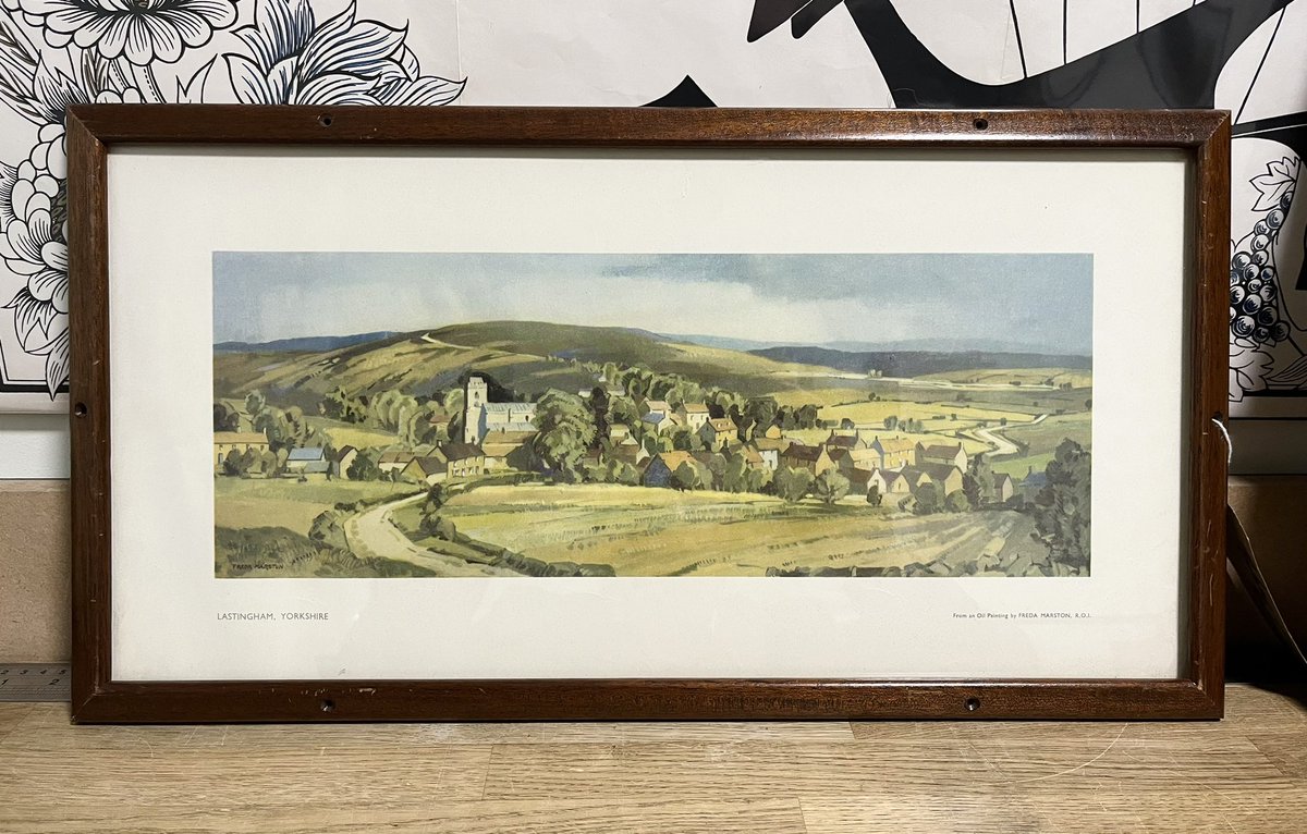 ‘Carriage prints’ were once a familiar part of UK rail travel. Displayed above the passenger seats & below the luggage rack, they showed all the wonderful places you could visit by train. This one is of Lastingham, Yorks, by Freda Marston