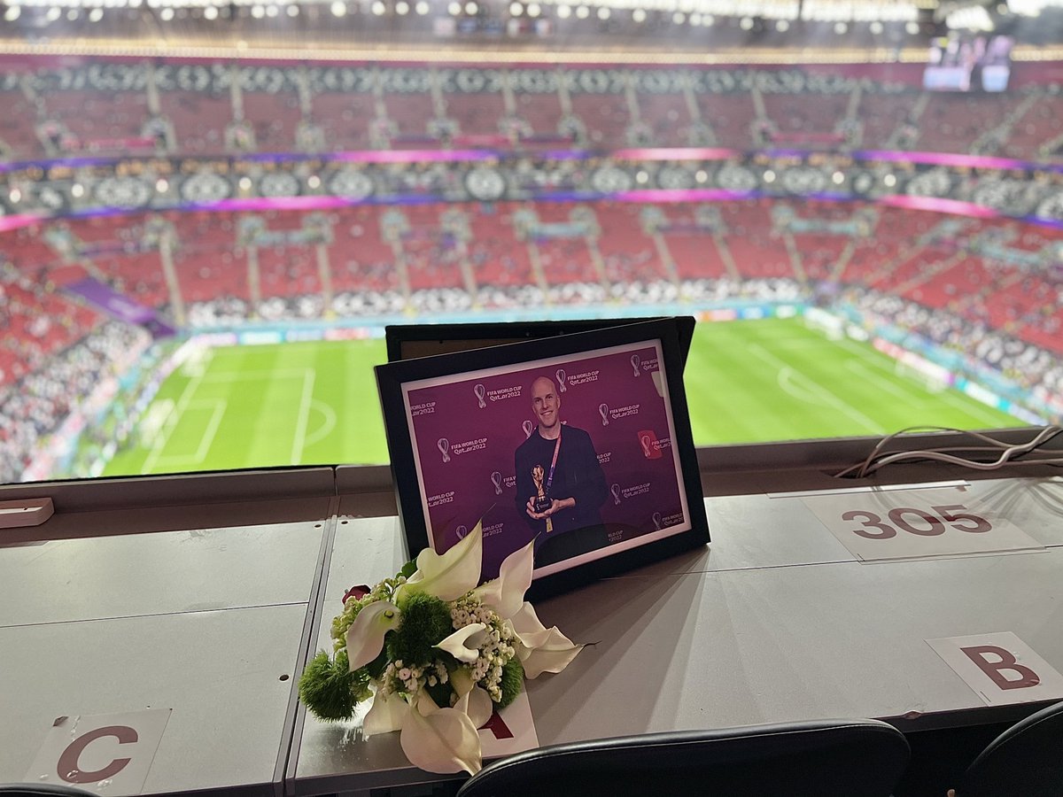 Meg_Swanick's tweet photo. Just arrived to Al Bayt Stadium for England v France. A few seats down, a memorial to Grant Wahl, in the place where he would have watched the game. 💛 https://t.co/ttpEnBGT61