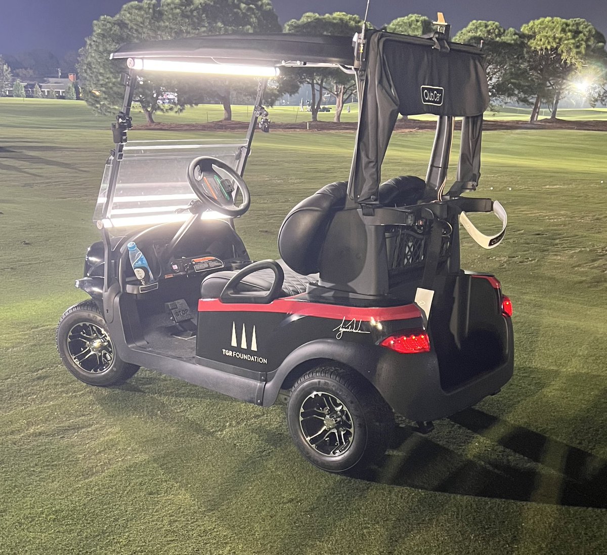 Troon's tweet photo. That’s Tiger’s golf cart for The Match tonight. It sold for $150k via auction benefiting Hurricane Ian relief efforts. #TheMatch https://t.co/gofeQgm9QH