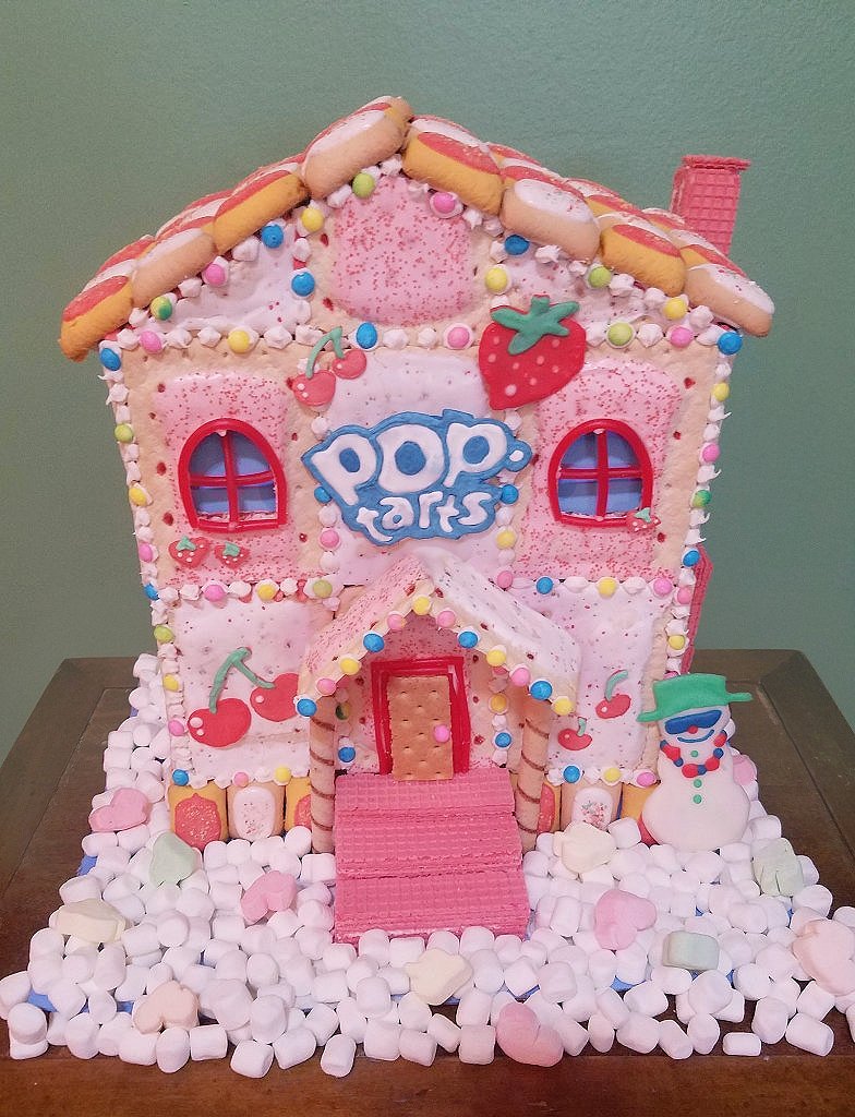 Kittenfishes's tweet photo. I'm finally finished with my berry merry mansion! Its my first time making & using royal icing, it was a lot of fun! Mostly used cherry, strawberry Poptarts and Poptart bites for the roof
@PopTartsUS
#GingerbreadPopTartEntry https://t.co/ib3XeM7h5Y