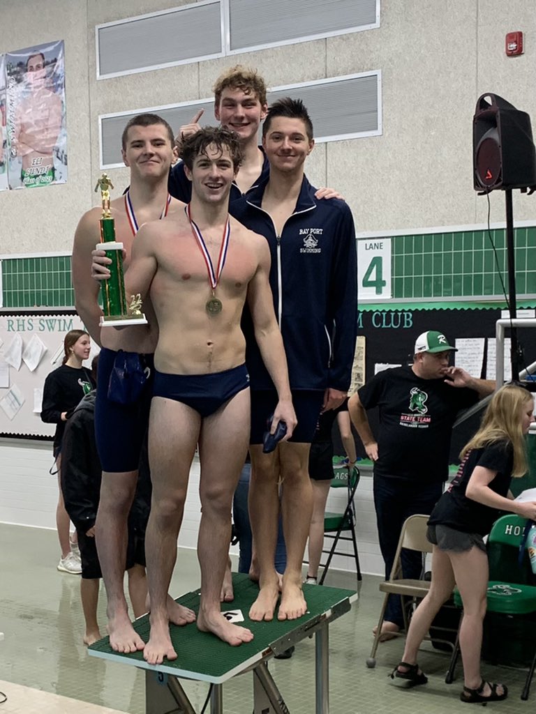 BayPortBoysSwim's tweet photo. The @BayPortHS captains Turner, Lawson, Will, and Dominick hoist the Rhinelander relays trophy. 

The Pirates won 6 of 10 events and set a pair of meet records. https://t.co/SKfC0qZpBp