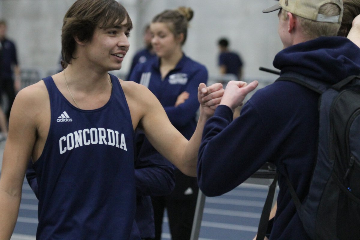 🎽 | The freshman Myles Sadd is congratulated by teammates after he got over the 'B' standard of 6' 7" in the high jump in his first college meet. Sadd has placed second in the event.