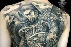 GuanBits's tweet photo. Why can't get a Guan Di tattoo open his eyes? 
Elder said: Guan Di’s aura is too strong, do not do it if your fate of life cannot carry it. 
So, owning his NFT or wearing his clothing will become the trend for the younger generation.

#NFTCommunity #guandi #tattoo https://t.co/bEFOGfHspL