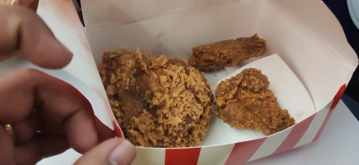 WithluckAj's tweet photo. Hey @KFC_India i do always order this all chicken box from airport bt this is what i got yesterday from kol airport. Just see this bite size chicken pieces!! Are we providing less as a new marketing strategy? Definitely not what I expect from kfc standards https://t.co/eTzzQyE4Bi