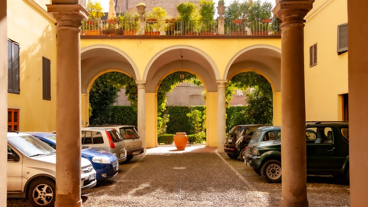 This is one of the most humane examples I’ve ever seen of Christopher Alexander’s Small Parking Lots pattern.