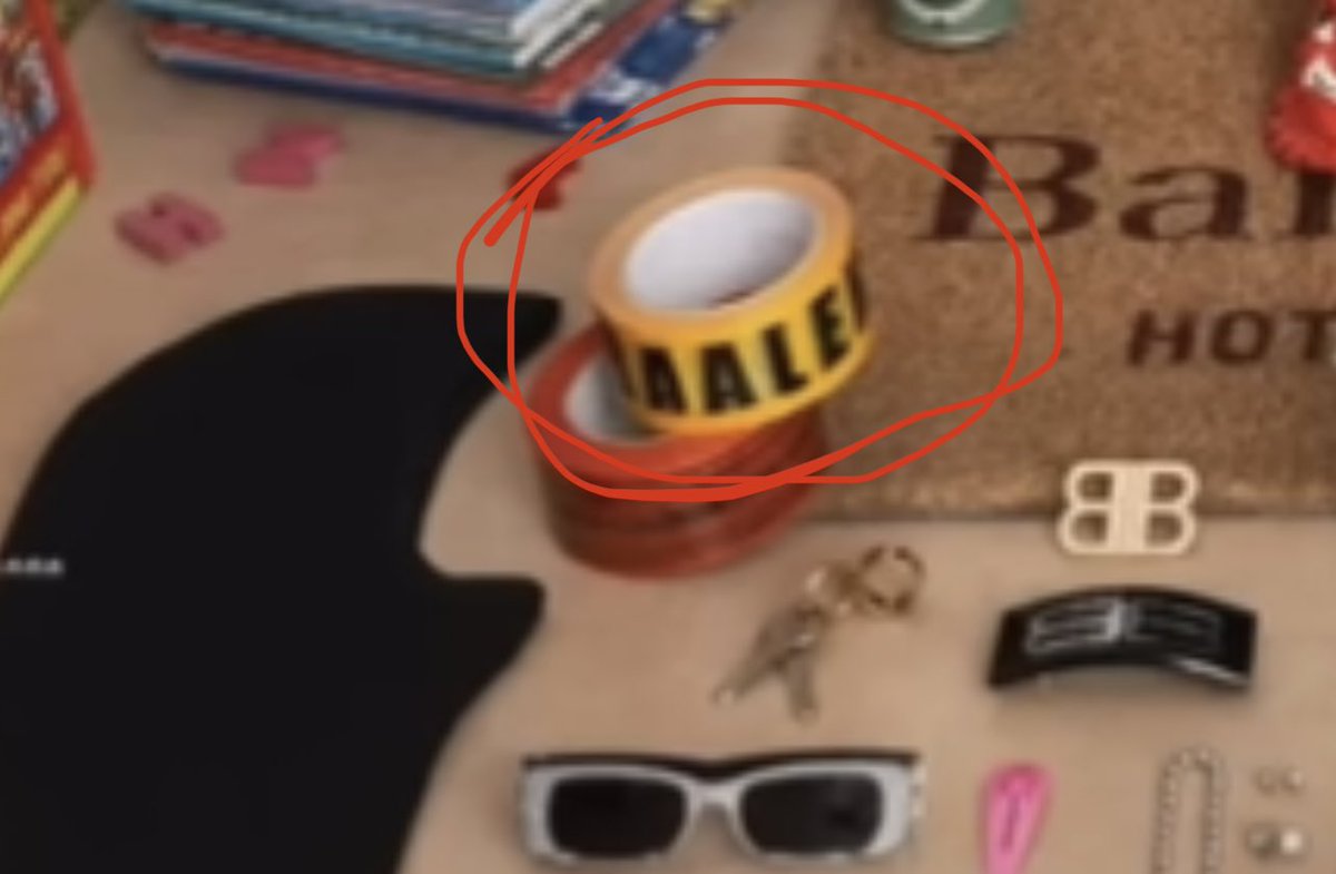 anatoliisharii's tweet photo. A clear phallic symbol, "accidentally" placed under the girl. On the ribbon with the boy, it’s “accidentally” written not Balenciaga, but “baale” with two “aa”.  This is Baal, the demon to whom children were sacrificed. Why aren't the stores closed yet?! https://t.co/oU5Wl2ZVx9