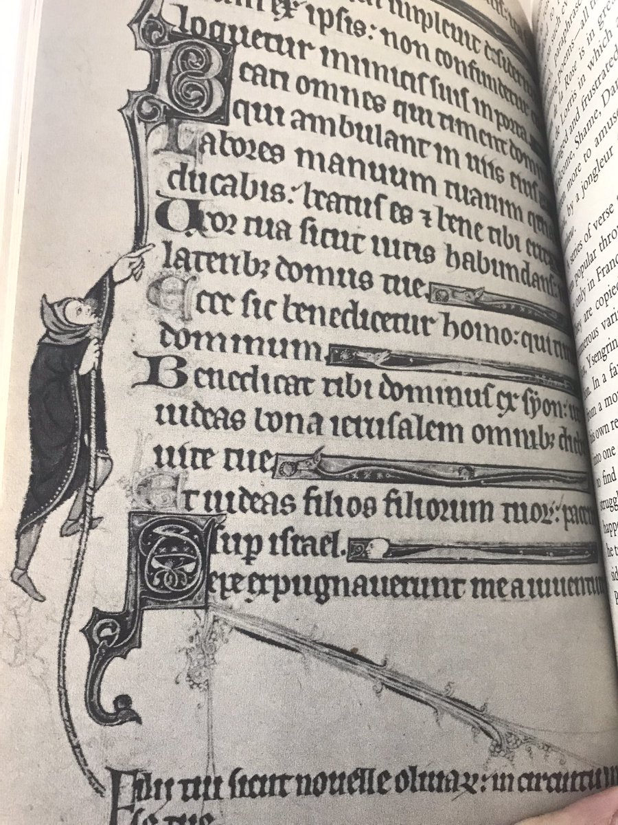jonnywakefield's tweet photo. TIL that it was fairly common for medieval copyists to accidentally leave out lines, so they’d add em at the bottom and the illustrator would draw a lil guy hauling it into the right place with a rope. https://t.co/blH8qTs84Q