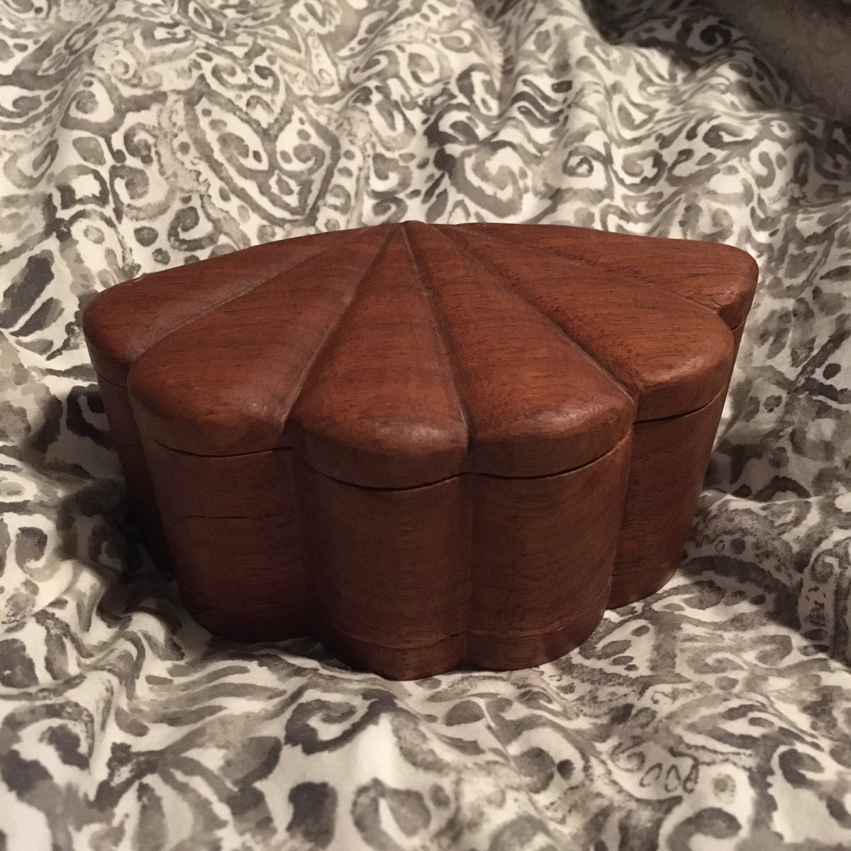 EllieTheNor's tweet photo. @cmclymer This beautiful treasure box, hand carved by my grandfather. I remember sitting on the floor opening it and my mom leaning in to whisper “He MADE that” before I could get the paper off. Every bit made with love, right down to the wooden hinge. https://t.co/pu3cJpc3ij