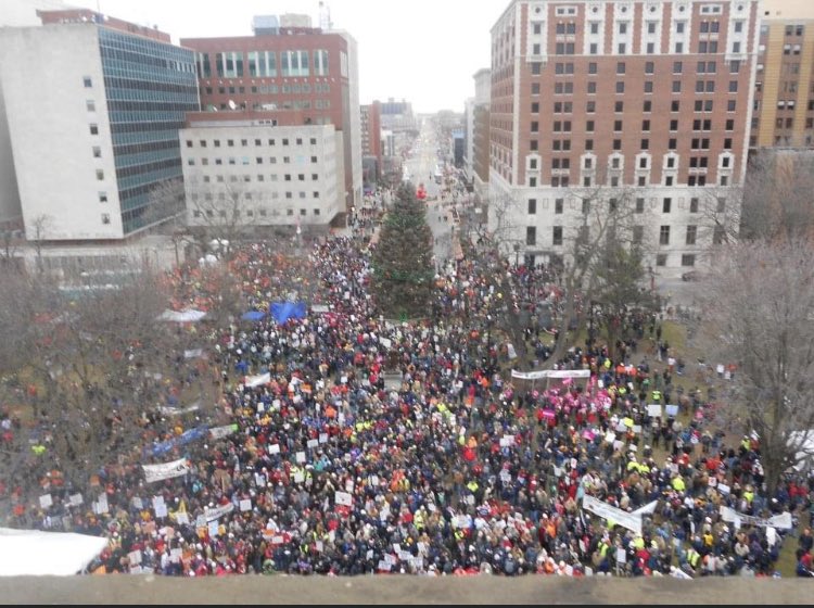 BetsyCoffia's tweet photo. I’m in that crowd somewhere, 10 years ago today protesting as GOP rammed thru union-busting “right to work (for less)” in Lame Duck. I was proud to stand up for workers rights then as a Michigander. Proud to stand up now as a MI state rep. Time to #RepealRTW photo cred @cynstom https://t.co/j7K7YxXkWl
