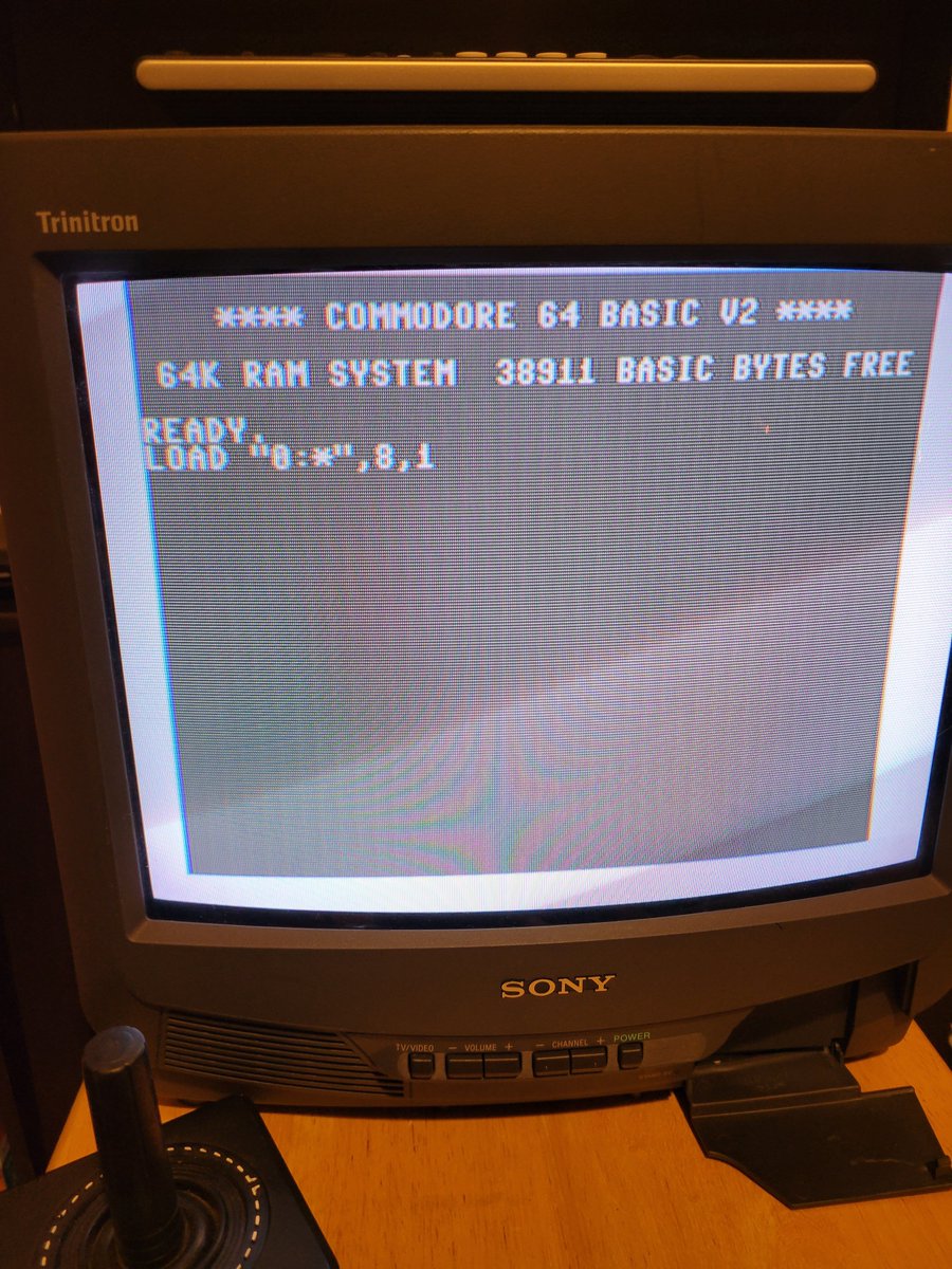 JoeCutrell's tweet photo. Got the old Commodore 64 booted up, with a few issues... Monitor not working and the "4" key is broken off. When I did get it connected to a small TV, the display is monochrome - haven't tried any repairs yet but did play a little Mule and Wolfenstein. @dez_blanchfield https://t.co/8qeprHiF62