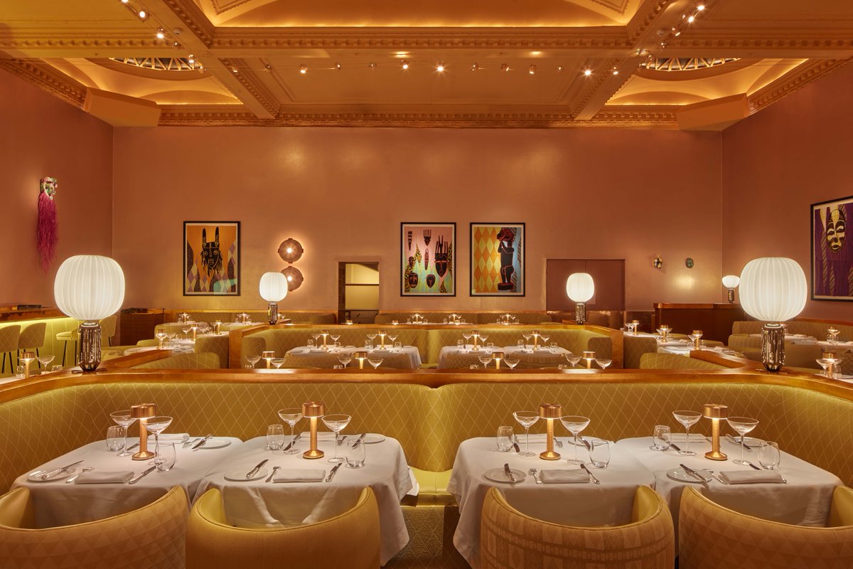 #DesignOfTheWeek | Metallic copper walls, yellow banquettes, & opulent fabrics – here is the Gallery at @sketchlondon to brighten up your Monday. 🌕 Featuring hand-painted masks and framed quilts, an art installation by @SHONIBARESTUDIO celebrates African culture & its legacy.