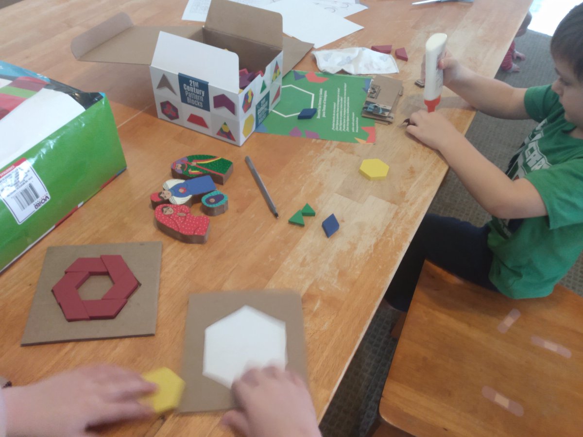 CBancos's tweet photo. I cut some hexagons out of cardboard to make it easier to do the #HexagonChallenge. This got Nathan interested in gluing! Unfortunately our glue is running low so he's having a frustrating time. I guess that's a plus for me since it limits his mess!
#21stCenturyPatternBlocks https://t.co/NatorXLYrP