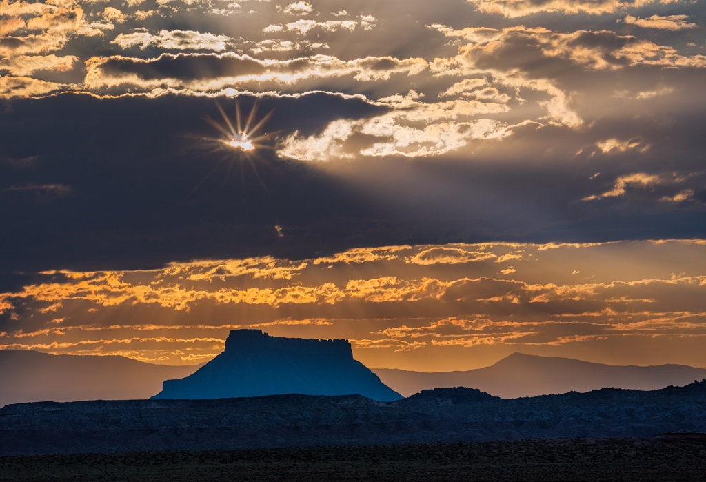 Factory Butte

The sun breaks through the clouds above Factory Butte.